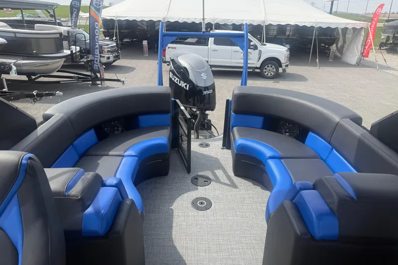 Slide: The Image of Interior of 2026 Berkshire 25RFX DC STS pontoon boat with blue and black seating. - 9