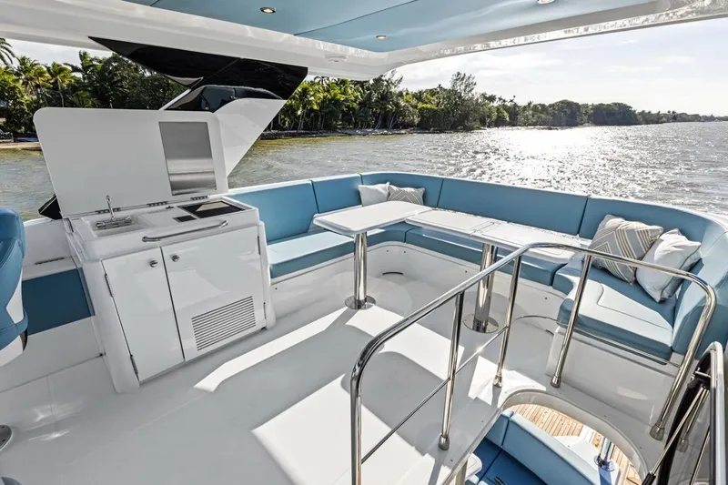 Slide: The Image of Luxurious 2026 Cruisers Yachts 50 Fly with spacious deck and modern seating area. - 53