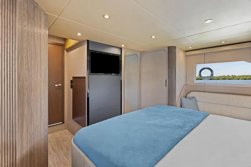 Slide: The Image of Luxurious interior of 2026 Cruisers Yachts 50 Fly with modern bedroom design. - 78