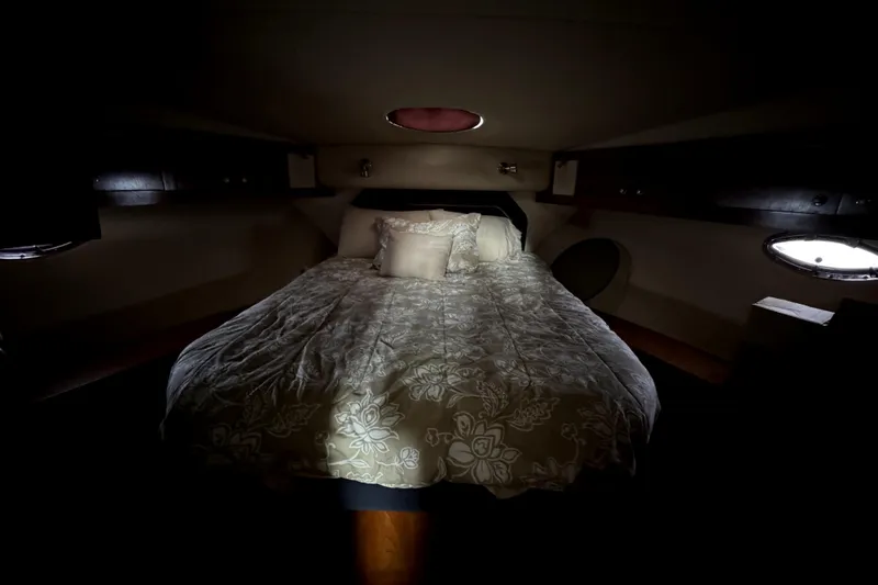 Slide: The Image of Luxurious bedroom interior of 2005 Cruisers Yachts 405 Express Motoryacht with elegant bedding. - 15