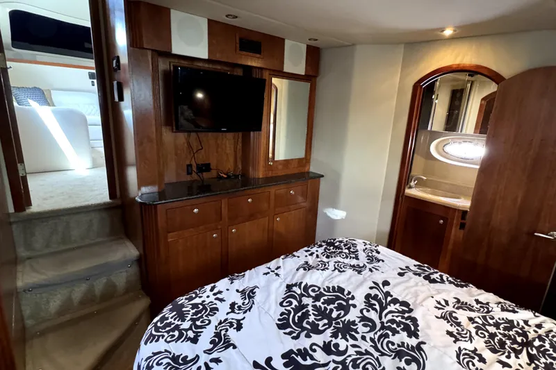 Slide: The Image of Luxurious 2005 Cruisers Yachts 405 Express Motoryacht interior with wood cabinetry and modern amenities. - 20
