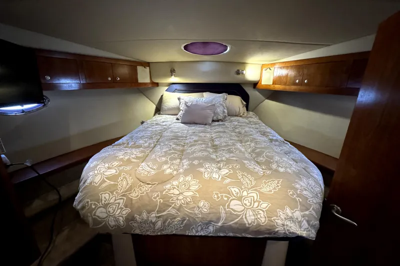 Slide: The Image of Luxurious bedroom in 2005 Cruisers Yachts 405 Express Motoryacht with floral bedding. - 23