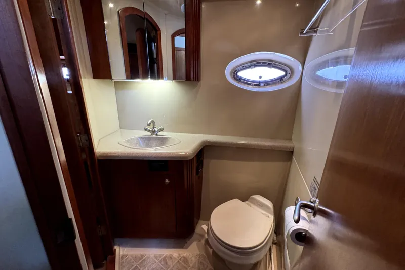Slide: The Image of Bathroom interior of 2005 Cruisers Yachts 405 Express Motoryacht with sink and toilet. - 24