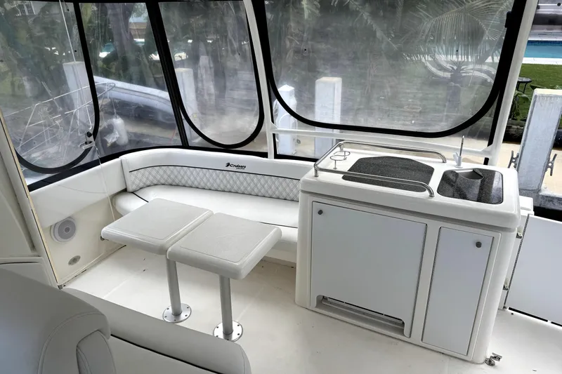 Slide: The Image of 2005 Cruisers Yachts 405 Express Motoryacht interior with seating and kitchenette area. - 7