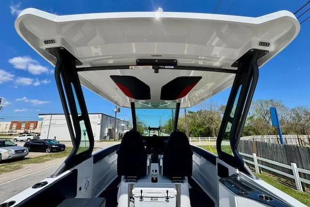 Slide: The Image of 2026 Monterey Elite 25 OB boat interior with modern design and spacious seating. - 13