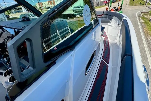 Slide: The Image of 2026 Monterey Elite 25 OB boat interior with sleek seating and modern design. - 18