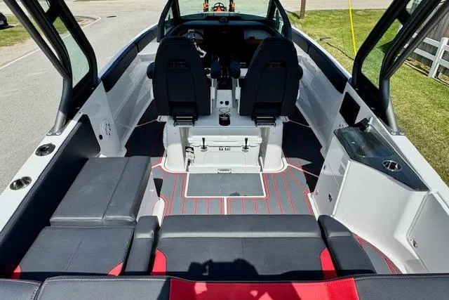 Slide: The Image of 2026 Monterey Elite 25 OB boat interior with sleek seating and modern design. - 7