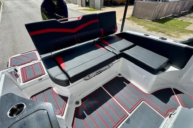 Slide: The Image of 2026 Monterey Elite 25 OB boat interior with stylish seating and modern design. - 8