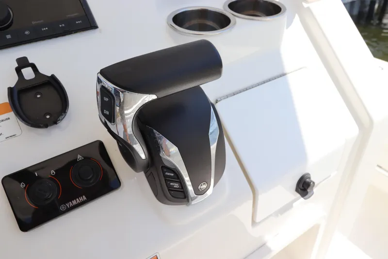 Slide: The Image of Close-up of 2021 Regulator 24XO boat controls featuring Yamaha throttle and panel. - 22
