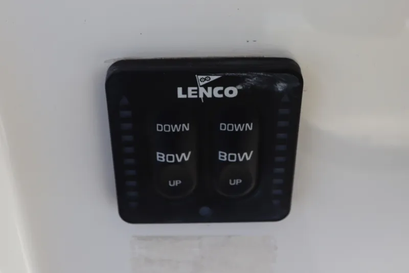 Slide: The Image of Lenco trim tab control on 2021 Regulator 24XO boat dashboard. - 23