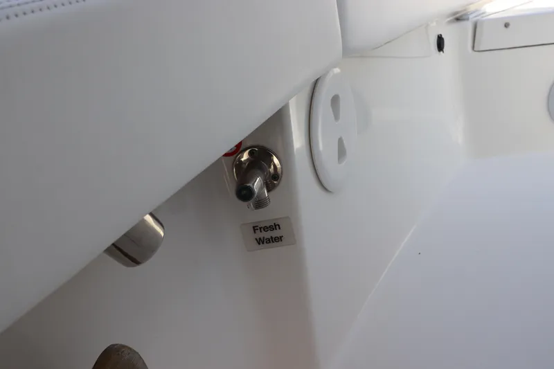 Slide: The Image of Fresh water outlet on 2021 Regulator 24XO boat interior. - 25