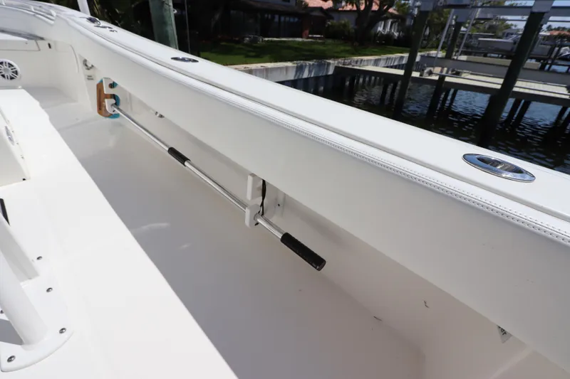Slide: The Image of 2021 Regulator 24XO boat interior with rod holder and clean white finish. - 26