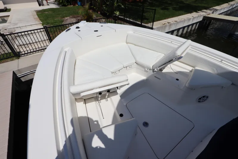 Slide: The Image of 2021 Regulator 24XO boat with white seating and spacious deck area. - 35