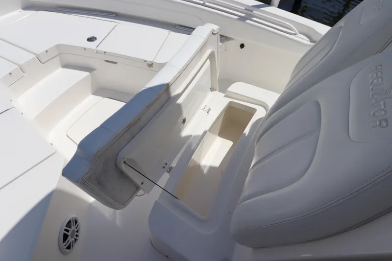 Slide: The Image of 2021 Regulator 24XO boat interior with open storage compartment and seating. - 37