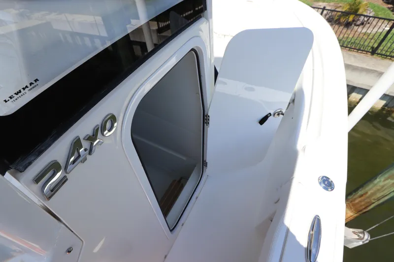 Slide: The Image of 2021 Regulator 24XO boat with open storage compartment, showcasing sleek design. - 38