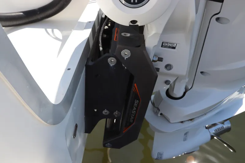 Slide: The Image of Close-up of a 2021 Regulator 24XO boat's SeaStar hydraulic steering system. - 4