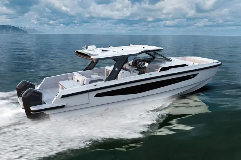 Slide: The Image of 2026 Aquila 45 Sport boat cruising on open water under a cloudy sky. - 1