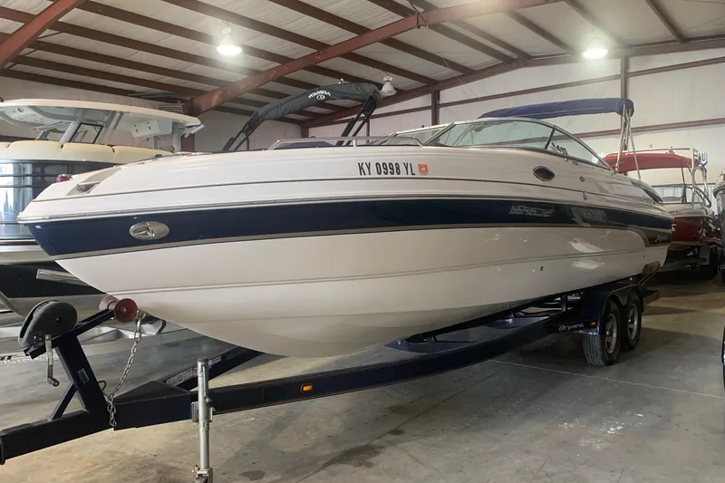 The Image of 2007 Bryant 270 boat on trailer in indoor storage facility. - 0