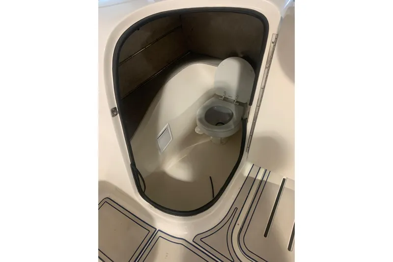 Slide: The Image of 2007 Bryant 270 boat interior with compact marine toilet. - 14