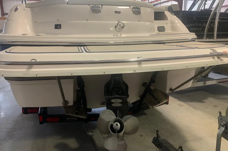 Slide: The Image of 2007 Bryant 270 boat rear view with propeller in indoor storage. - 2