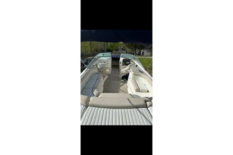 Slide: The Image of Interior view of a 2007 Bryant 270 boat with seating and steering console. - 24