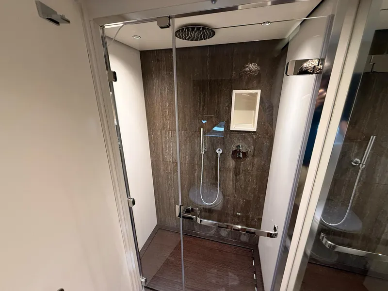 Slide: The Image of Luxurious shower in 2026 Azimut Magellano 25M yacht, featuring sleek glass doors and modern fixtures. - 27