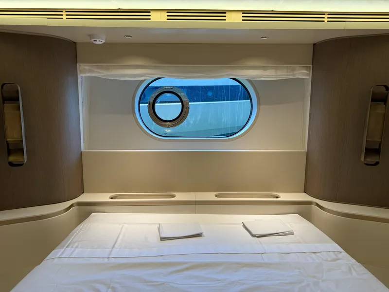 Slide: The Image of Luxurious cabin interior of 2026 Azimut Magellano 25M yacht with porthole window. - 8