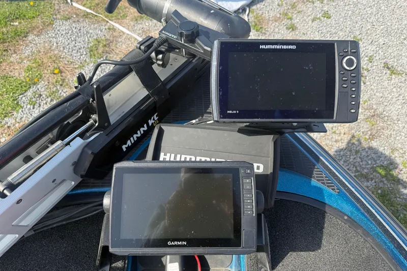 Slide: The Image of Fishfinder and GPS units on a 2006 Triton Tr-196 SC boat deck. - 10