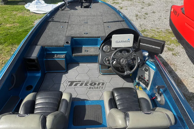 Slide: The Image of 2006 Triton Tr-196 SC boat interior with Garmin and Humminbird electronics. - 6