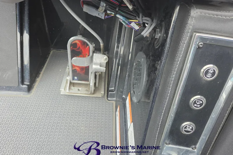Slide: The Image of 2023 Ranger Z520R boat controls with foot pedal and dashboard buttons. - 14