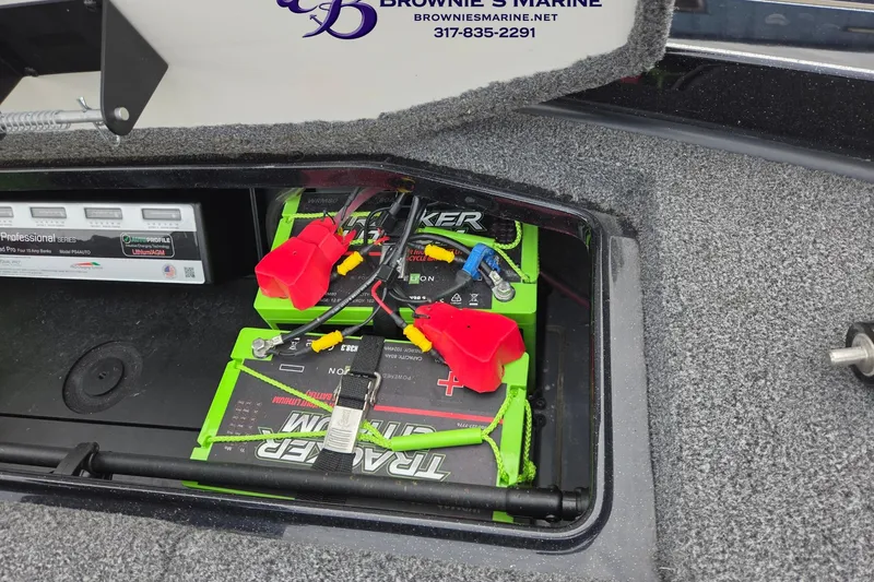 Slide: The Image of 2023 Ranger Z520R boat battery compartment with dual Tracker Marine batteries and wiring. - 16