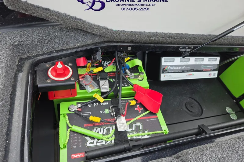 Slide: The Image of 2023 Ranger Z520R boat battery compartment with wiring and power switch. - 17