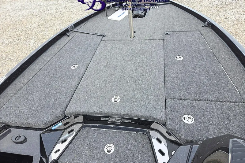 Slide: The Image of 2023 Ranger Z520R boat deck with storage compartments and textured surface. - 8