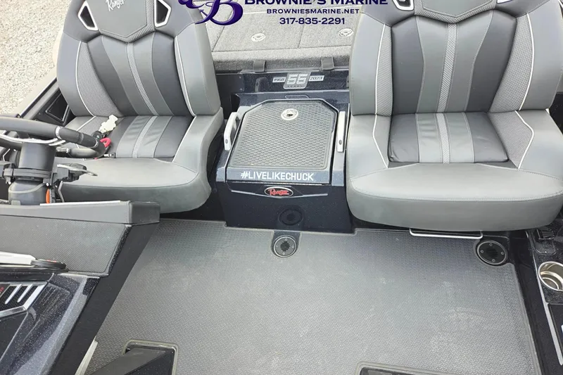 Slide: The Image of 2023 Ranger Z520R boat interior with dual seats and steering console. - 9