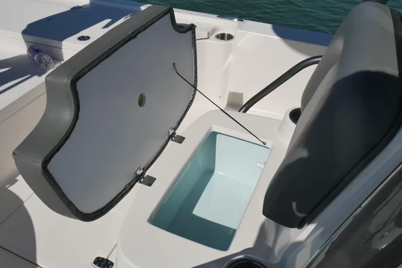 Slide: The Image of 2023 Sea Born FX24 Bay boat seat with open storage compartment. - 15