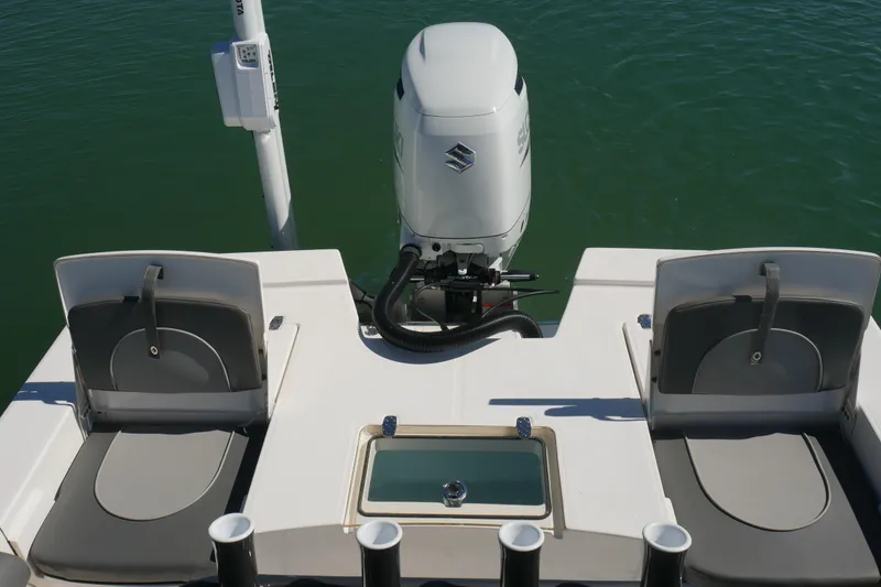 Slide: The Image of 2023 Sea Born FX24 Bay boat with dual seats and Suzuki outboard motor. - 24
