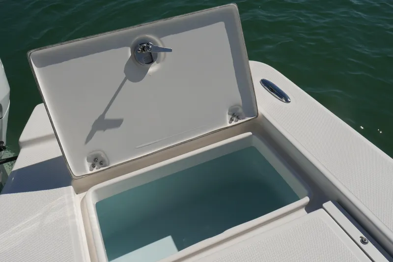 Slide: The Image of 2023 Sea Born FX24 Bay boat with open storage compartment on deck. - 27