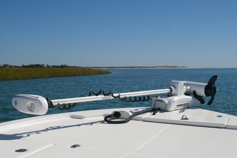 Slide: The Image of 2023 Sea Born FX24 Bay boat with Minn Kota trolling motor on calm water. - 7