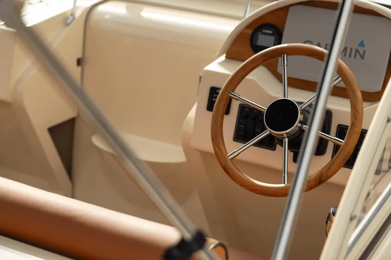 Slide: The Image of Steering wheel of 2026 Rossiter 23 boat with Garmin navigation system. - 4