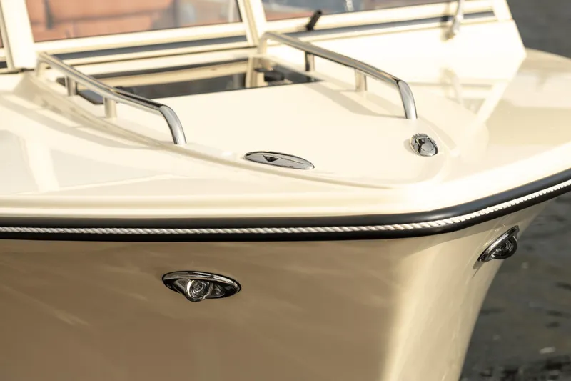 Slide: The Image of Elegant Rossiter 23 boat bow, 2026 model, featuring sleek design and polished chrome details. - 6
