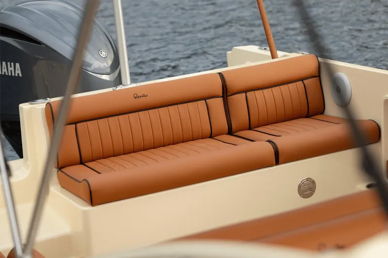 Slide: The Image of Luxurious seating on a 2026 Rossiter 23 boat with Yamaha engine in the background. - 7