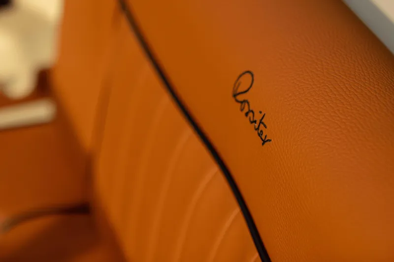 Slide: The Image of Luxurious tan leather interior of 2026 Rossiter 23 with elegant stitching. - 8