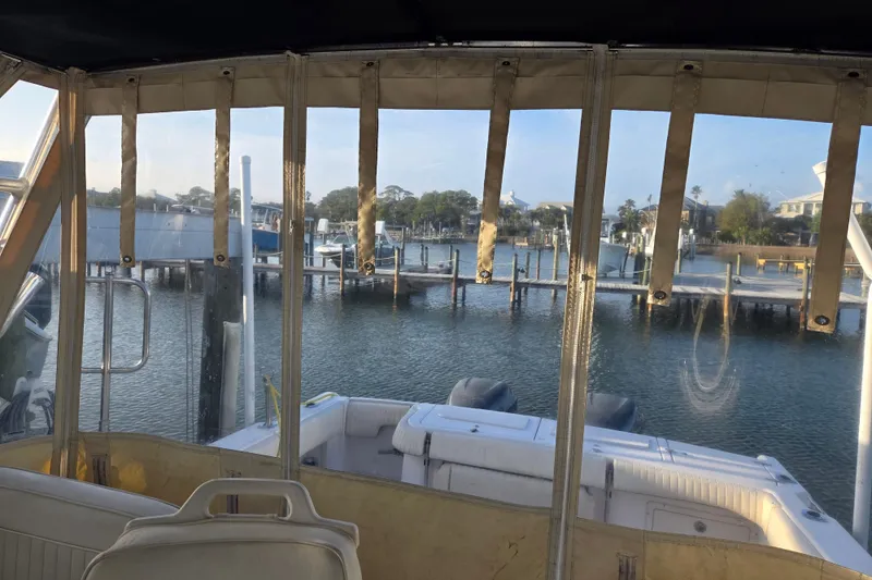 Slide: The Image of 2004 Grady-White Express 330 boat interior view at a marina. - 15