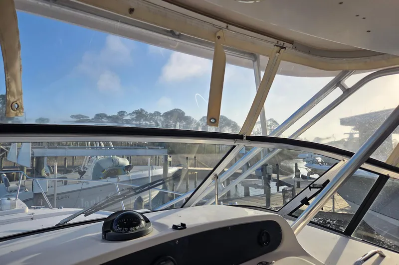 Slide: The Image of Interior view of a 2004 Grady-White Express 330 boat at a marina. - 17
