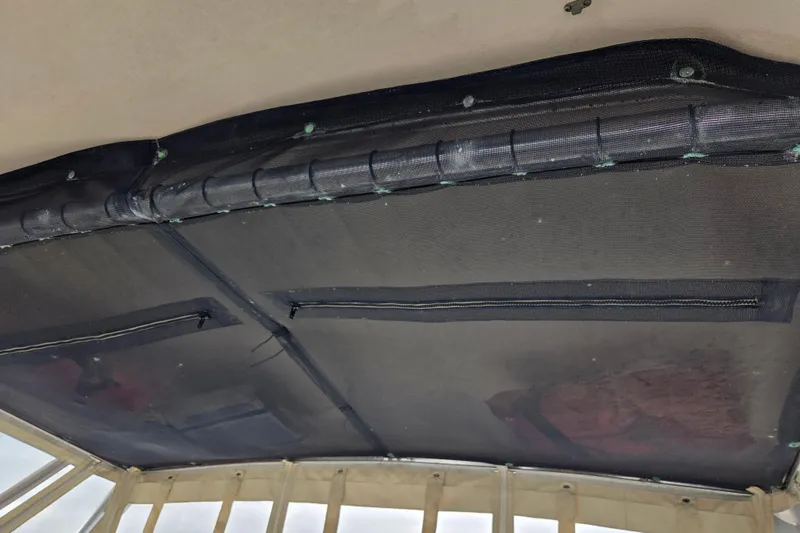 Slide: The Image of Interior view of 2004 Grady-White Express 330 boat canopy with mesh covering. - 23