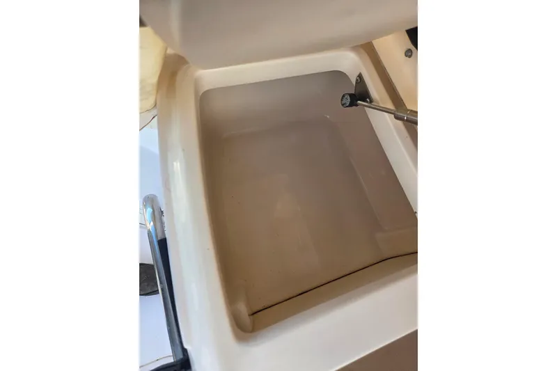 Slide: The Image of Open storage compartment on 2004 Grady-White Express 330 boat. - 31