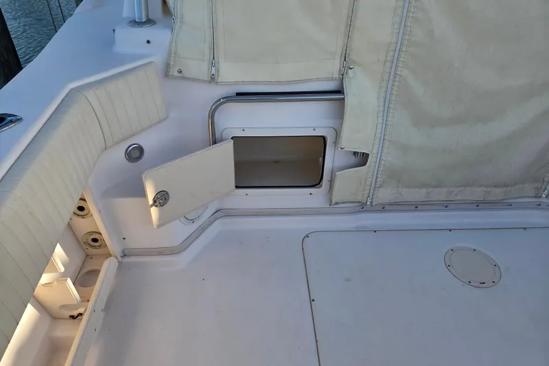 Slide: The Image of 2004 Grady-White Express 330 boat interior with open storage compartment. - 44