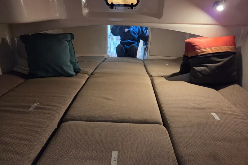 Slide: The Image of Interior cabin of 2004 Grady-White Express 330 with cushions and pillows. - 50