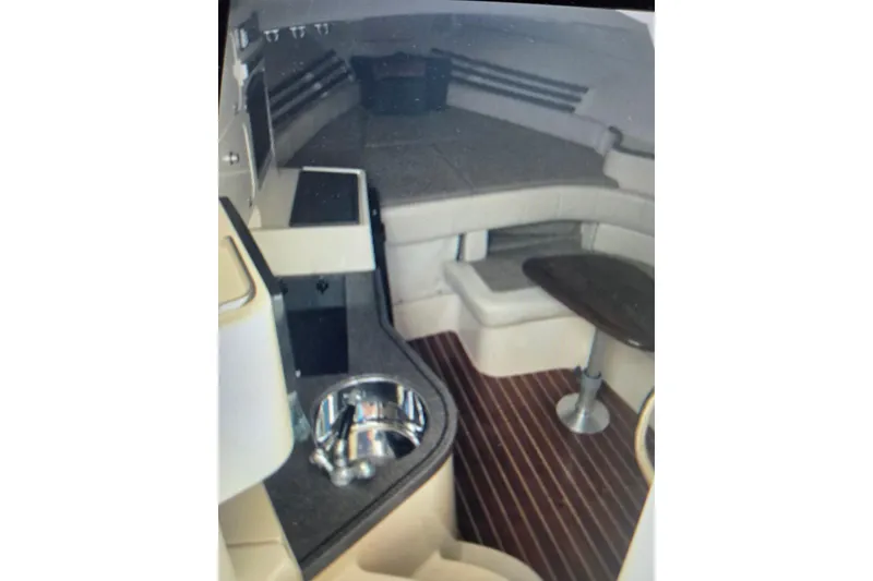 Slide: The Image of 2004 Grady-White Express 330 cabin interior with seating and table. - 54