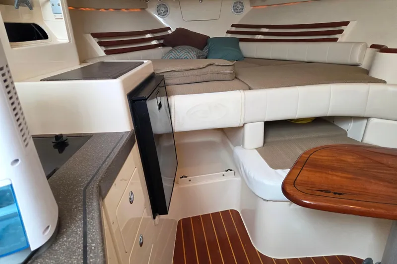 Slide: The Image of Interior of 2004 Grady-White Express 330 boat with cozy cabin and kitchenette. - 56